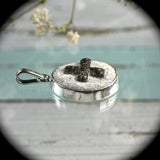Cruciform twinned staurolite crystals sterling silver pendant