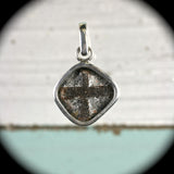 Cruciform twinned staurolite crystals sterling silver pendant
