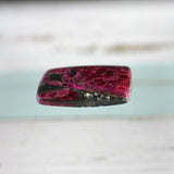 Eudialyte both sides polished iridescent pebble-cabochon pocket stone