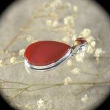 Carnelian sterling silver pendant with inlaid bail