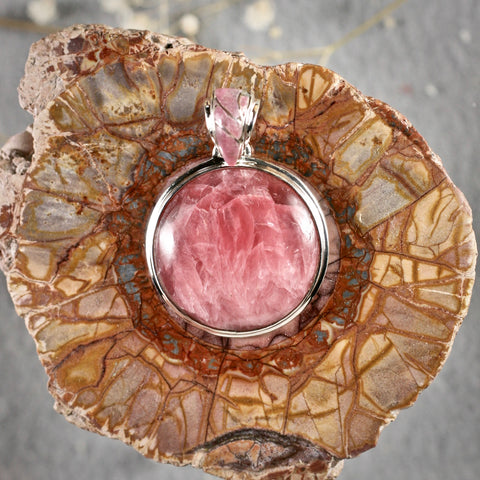 Rhodochrosite sterling silver round pendant with inlaid bail